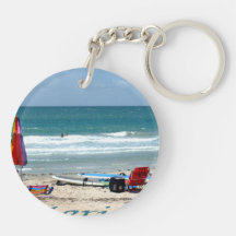 beach chairs surfboards umbrellas sand ocean keychain