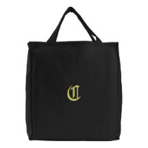 Den broderade monogramen för brev C hänger lös Kassar