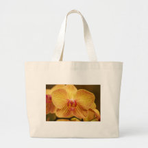 Den gula orchiden med rosa randar hänger lös tygkassar