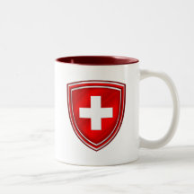 Dubbla skyddar den schweiziska emblemen för De Sch Kaffe Muggar