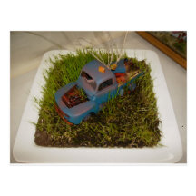 En gammal miniatyrvarubillastbil vykort