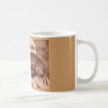 En taxmamma och henne bebis kaffe muggar