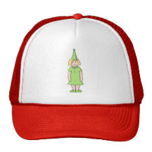 Flicka i en grön födelsedagOutfit. Kepsar