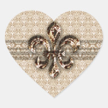 Guld- Fleur De Lis med det kräm- damastast mönster Hjärtformade Klistermärken
