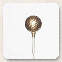 Guld- golfboll och utslagsplats kopp underlägg