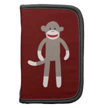 Gullig sock monkey på rött med randar personlig almanacka av folio