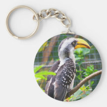 hornbill on perch in green plants keychain