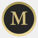 M:: Elegantt guld för Monogram M och svartklisterm