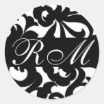 Monogrammed svart vitklistermärke