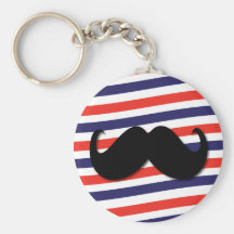 Mustasch med röda, vit- och blåttrandar nyckel ring