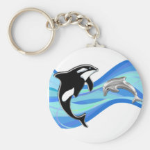 Orca och delfin i vågar nyckel ringar