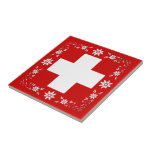 Schweizareflagga och edelweiss kakel