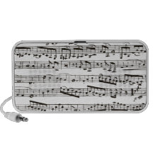 Svartvit musik noter laptop högtalare