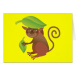 Tarsier nederlag under ett grönt löv hälsnings kort