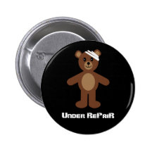 Under reparera nalleemblem/knäppas knappar