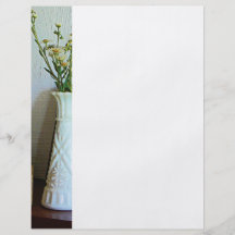 Vas med vildblommar flyg blad