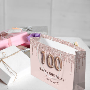 100-årsdagen rosa glitter droppar i ro guld