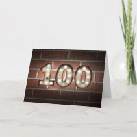 100:e födelsedagsljuset på en vägg