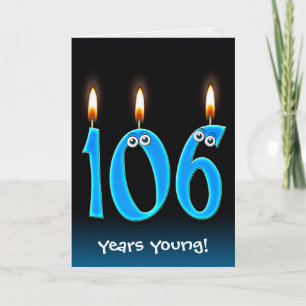 106-årsstearinljus på svart kort
