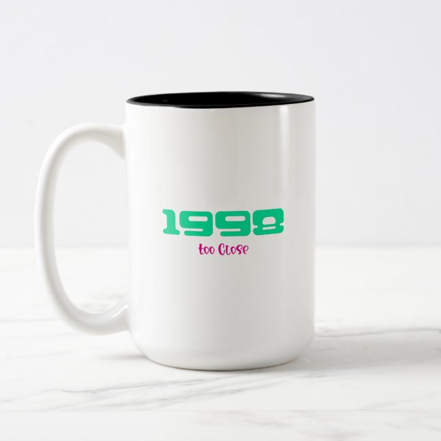 1998 års topplåt Två-Tonad mugg (Vänster)