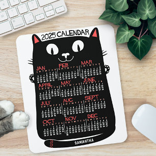 2023 års månadskalender svart katt i mitten av årh musmatta