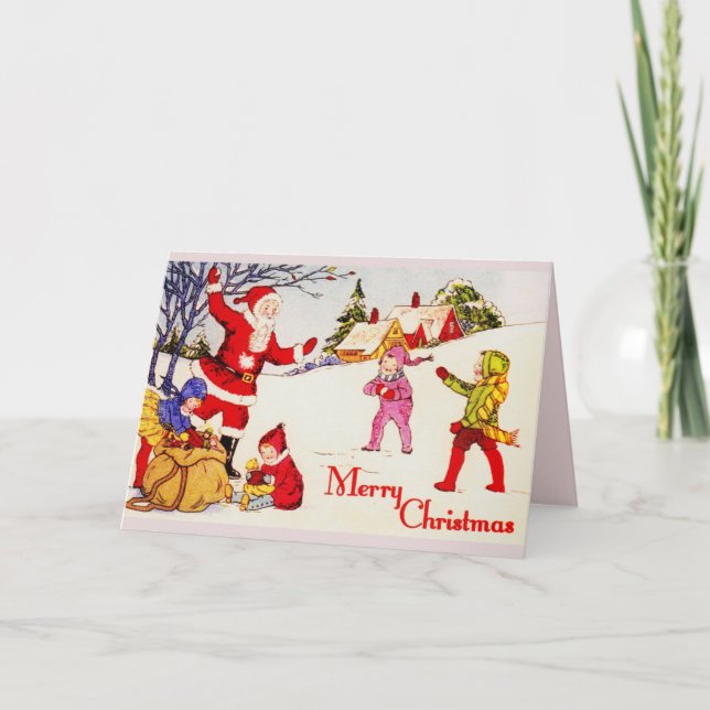 20-tal Santa och barn som leker i snön Helgkort (Framsida)