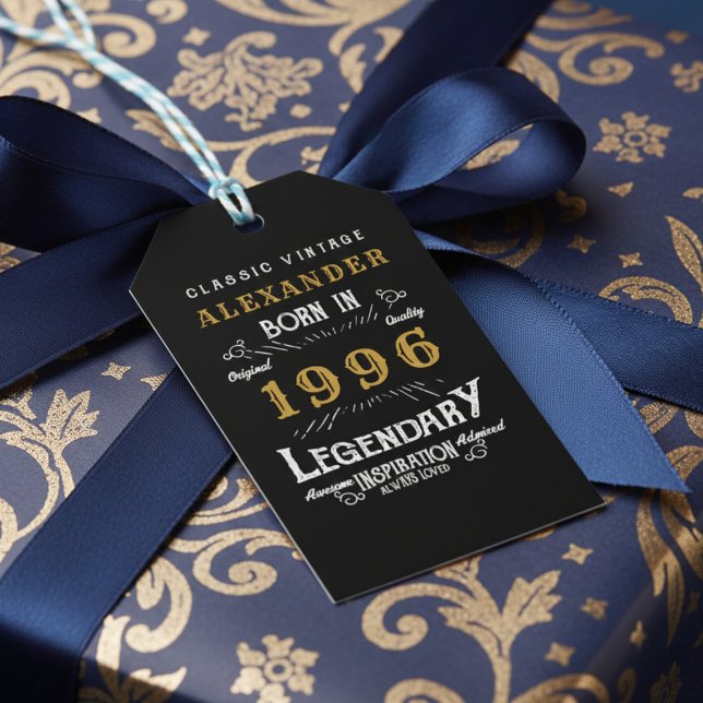 30th Birthday 1996 Add Name Legend Black Gold Presentetikett (Born 1996 birthday gift tag. Background blue bow and blue and gold wrapping paper.)