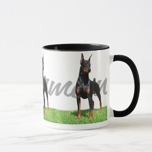 3 svart DobermanPinschers med det grafiska Mugg (Höger)