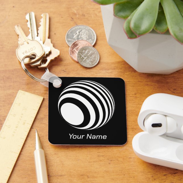 3D-Ball mit weißen Streifen -  Nyckelring (Skrivbord)