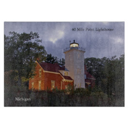 40 Mile Point Lighthouse vid skymning skärbräda