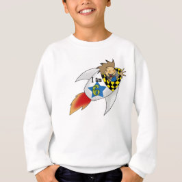 6 år gammal pojke i en raketlek tee shirt