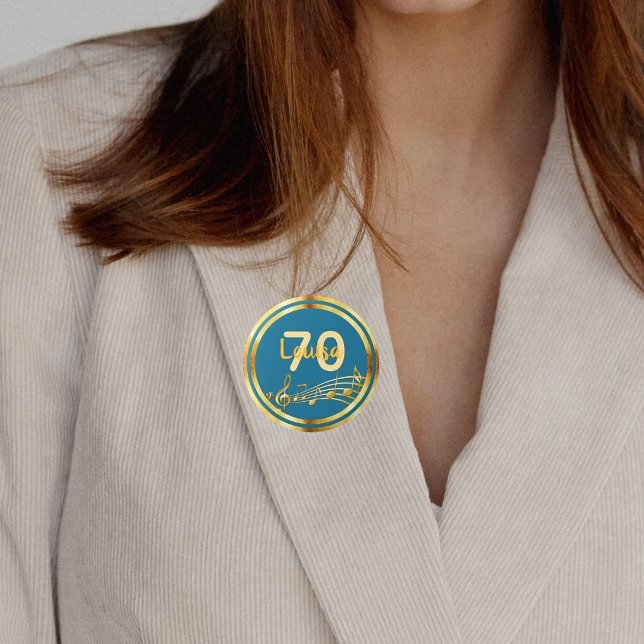 70-årsdagen guld musik noter på tealblått grönt knapp (Skapare uppladdad)