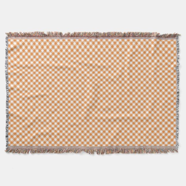 A checkered pattern throw blanket with orange  filt (Framsidan)