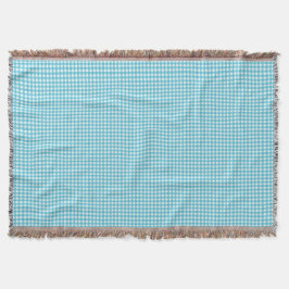 A light blue and white checkered blanket  filt