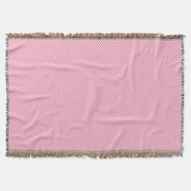 A pink woven blanket with a subtle pattern  filt (Framsidan)