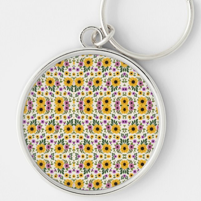 A round keychain with a floral pattern rund silverfärgad nyckelring (Framsidan)