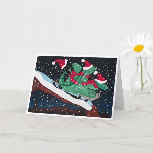 A whimsical holiday card with sledding dinosaurs kort (Liten växt)