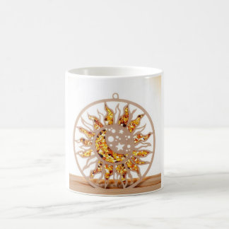 a white mug with an image of sun and moon kaffemugg