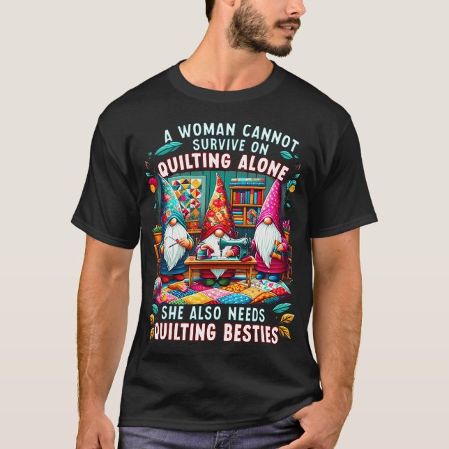 A Woman Cannot Survive On Quilting Alone She Also  T Shirt (Framsida)