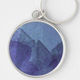 Abstrakt av blåhavskaraktär rund silverfärgad nyckelring