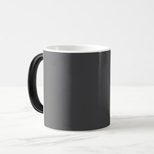 Abstrakt bild av en stor mörkgrå rektangel  magisk mugg (Framsida vänster)