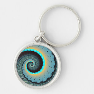 Abstrakt blå turkos orange fraktal konst spiral rund silverfärgad nyckelring