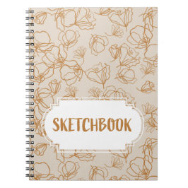 Abstrakt blommor över beige anteckningsbok