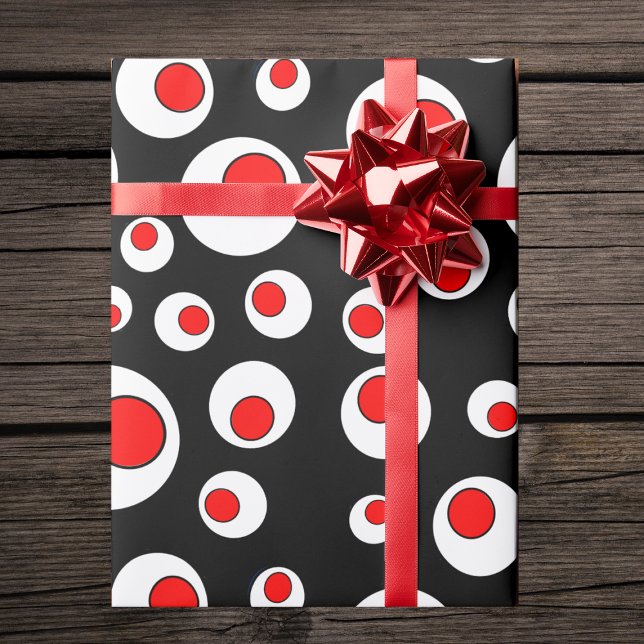 Abstrakt geometrisk kall röd vit cirklar presentpapper (Abstract bold geometric circle pattern in red white black on gift wrapping paper roll.)