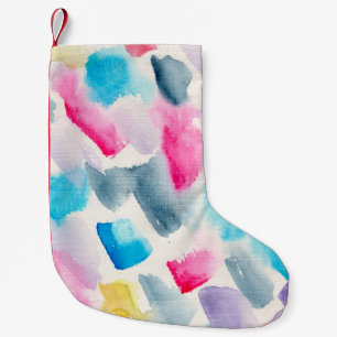 abstrakt med handgjorda vattenfärgspenseldrag, bak liten julstrumpa