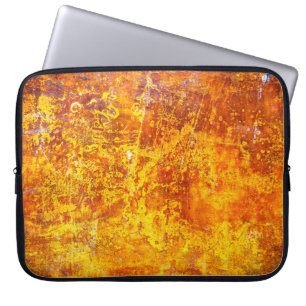 Abstrakt orange struktur betongvägg, laptop fodral
