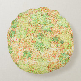 Abstrakt per löv på skrapad mark på beige rund kudde