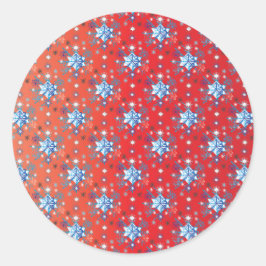 Abstrakt röd och blå jul snöflingor runt klistermärke