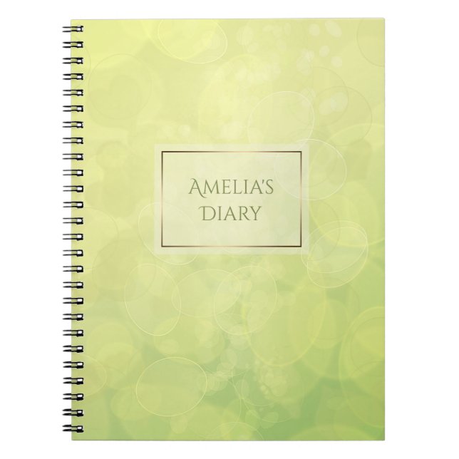 Abstrakt struktur för bokehgröntlimefrukt. Namn Anteckningsbok (Framsidan)