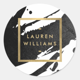 Abstrakt svart bläck penseldrag runt klistermärke